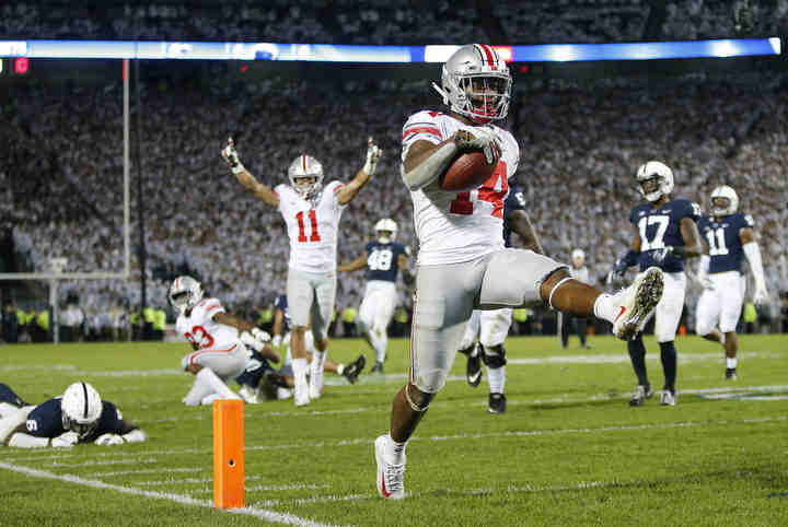 Ohio State Buckeyes wide receiver K.J. Hill Jr. (14) high steps into the endzone for a 24-yard go-ahead touchdown during the fourth quarter of the NCAA football game against the Penn State Nittany Lions at Beaver Stadium in University Park, Pa. on Sept. 29, 2018. The Buckeyes won 27-26.   (Adam Cairns / The Columbus Dispatch)